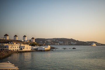Naklejka premium Little Venice, Mykonos, Greece. Iconic view of the windmills