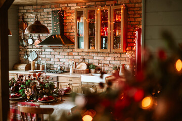 kitchen in authentic stylish chalet decorated for Christmas or New Year eve dinner, details of a cozy kitchen interior with a brick wall