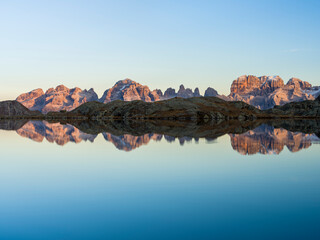Naklejka premium The summits of Brenta mountain range are reflected in Lago Nero. Brenta group in the Dolomites, part of UNESCO. Europe, Italy, Val Rendena