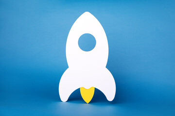 rocket over blue  background,  business startup, new idea and new project concept.