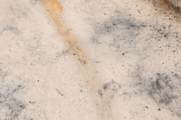 White dirty sand after draining industrial chemical waste, contaminated soil and ground background