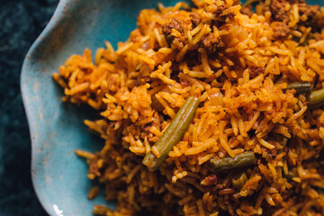 Lubia polo Persian rice dish with ground beef, green beans, turmeric 