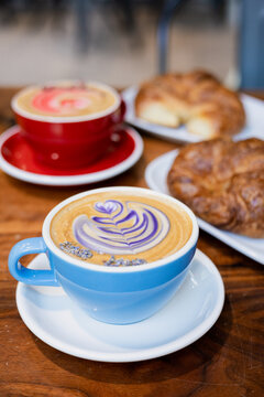 Cups of coffee with croissants on the table