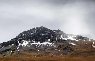 Close-up view on the snow covered mountains peak. Armenia, Aragats.