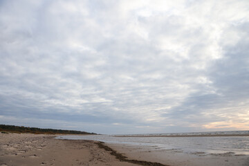 Beautiful seascape shore view with sand and Baltic sea.