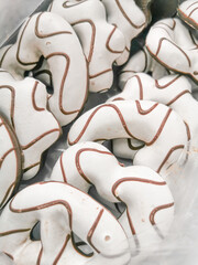 Box of Christmas gingerbread cookies in white glaze.