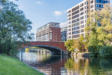 Banks of the Landwehr Canal Salzufer with the bridge Dovebruecke in Berlin, Germany