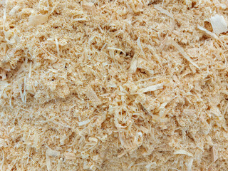 Background made of wood chips, closeup shot, wooden texture.