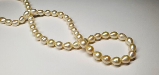 Fototapeta premium A beautiful necklace made of natural pearls. Pearl jewelry for women. Precious stones.