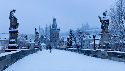 Prague gothic Charles Bridge with its Statues after sunset, Czech Republic