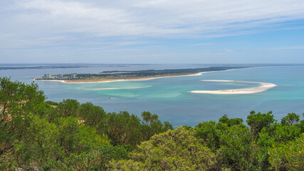 Naklejka premium Troia Peninsula or Tróia Nature Reserve is part of Sado Estuary natural park. Atlantic Ocean and azure lagoon. Resort with long sandy beaches. Panoramic view from observation deck of Serra da Arrábida