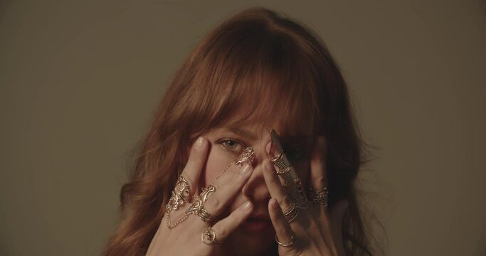 Beautiful Young Redheaded Woman With Ornate Gold Rings