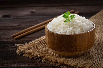 Bowl with cooked rice on the table.