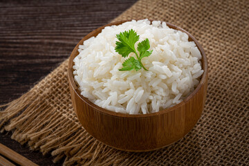 Bowl with cooked rice on the table.