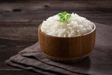 Bowl with cooked rice on the table.