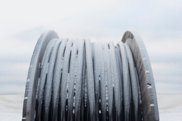 Black broadband cable in winter