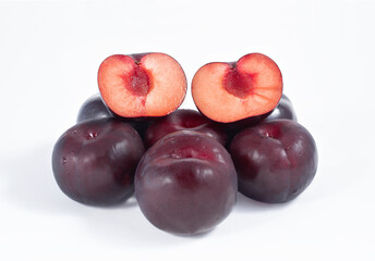 A bunch of plums on a white background.