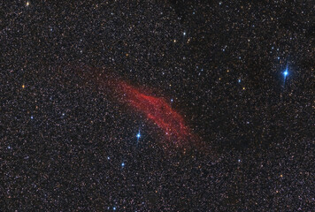The California Nebula, an emission nebula located in the constellation of Perseus that resembles the outline of the US state of California. Long exposure photography.