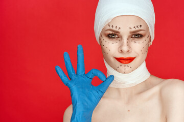 woman posing in blue gloves red lips surgery facial rejuvenation isolated background