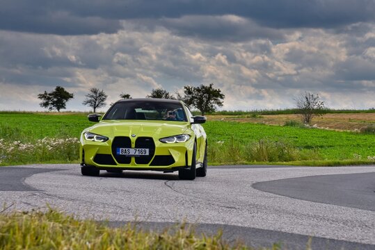 BMW M4 Coupe. Sports car with manual transmission. In the ride. 07-29-2021, Prague, Czech Republic.
