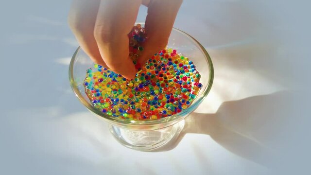 Many small jelly balls in the glass. Multicolored candy balls. 