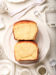 Top View Sandwich Milk Bread, Sliced in Pieces, on White Plate Background. Promotional Flyer for Hokkaido Milk Loaf. Japanese White Bread Banner. Home Baking