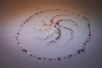 Spiral ornament lined with stones on the sand in Echo Park Campground, Dinosaur Nation Monument,...
