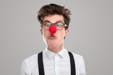 Funny angry man with clown nose