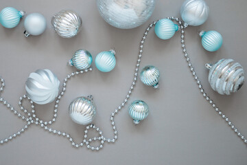 New year and Christmas tree decorations on grey background