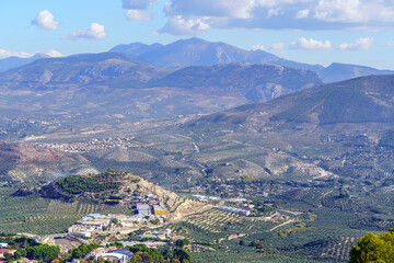 Aerial view of the Andalusian city of Jaen next to the high mountains and its olive groves.