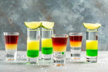 collection of colorful shots. Set of cocktails at the bar. alcoholic cocktail drinks shot with lime