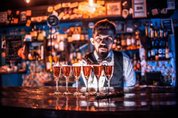 Bartender mixes a cocktail in the pothouse