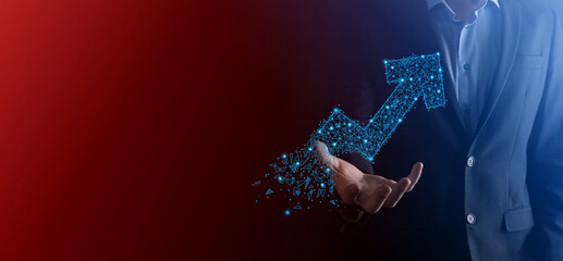 Businessman hold graph, arrow of positive growth icon.pointing at creative business chart with upward arrows.Financial, business growth concept.Low polygonal.increased sales, or increased value