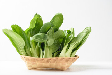 Bok choi (white cabbage) on a white background Ingredients in Asian Vegetarian and Healthy Food