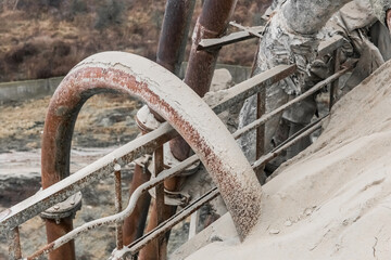 Old pipe on the barrel. White fertilizers or sand pipeline filtration of chemical and mineral...