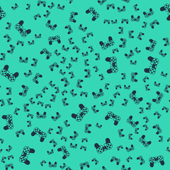 Black Game controller or joystick for game console icon isolated seamless pattern on green background. Vector