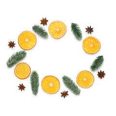 Christmas background. Slices of dried orange, anise and spruce branches on a white background