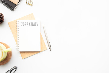 Notebook with 2022 goals text on it to apply new year resolutions and plan.