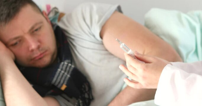 Close up of a Doctor holding syringe taking coronavirus vaccine dose from vail preparing for covid 19 vaccination for patient.