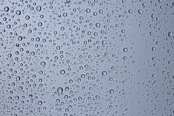 gray wet background / raindrops to overlay on the window, weather, background drops of water rain...