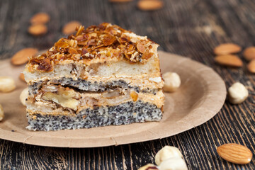 sweet cake with buttercream and sponge cake and lots of poppy seeds and nuts