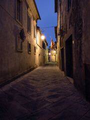 Fototapeta na wymiar Montalcino Old Town Moody, Dark Alley at Night in Tuscany, Italy