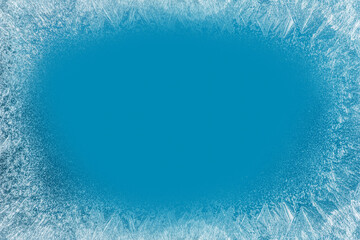 Frost patterns on frozen winter window as a symbol of Christmas wonder. Christmas or New year...