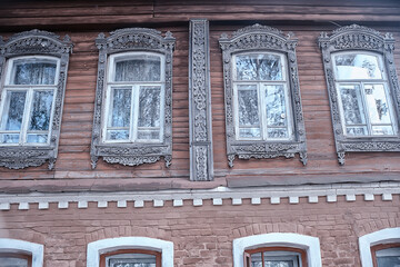 Naklejka premium windows in an old wooden house, russian north architecture design
