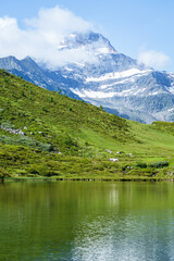 Naklejka na ściany i meble The meadows, glaciers, lakes and mountains of the Simplon Pass: one of the most beautiful areas of Switzerland located in the heart of the Alps - July 2021.