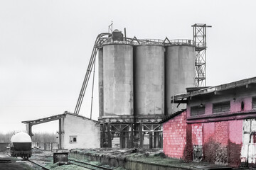 Fototapeta na wymiar Fuel old chemical tank fertilizer barrel oil in an industrial abandoned plant