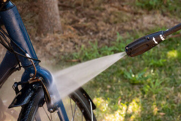Cleaning washing a bilcycle wheels with pressure washer cleaner. Self service do it yourself maintenance