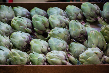 Fototapeta premium Fresh green artichokes on the market