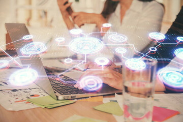 Double exposure of woman hands typing on computer and social network theme hologram drawing. People media concept.