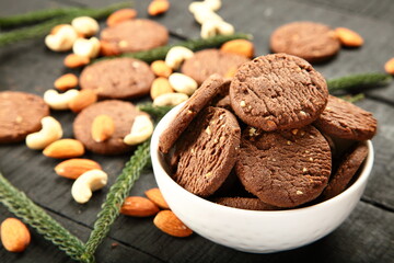 Bowl of fresh baked dry fruits, cashew nuts, almonds cookies.
